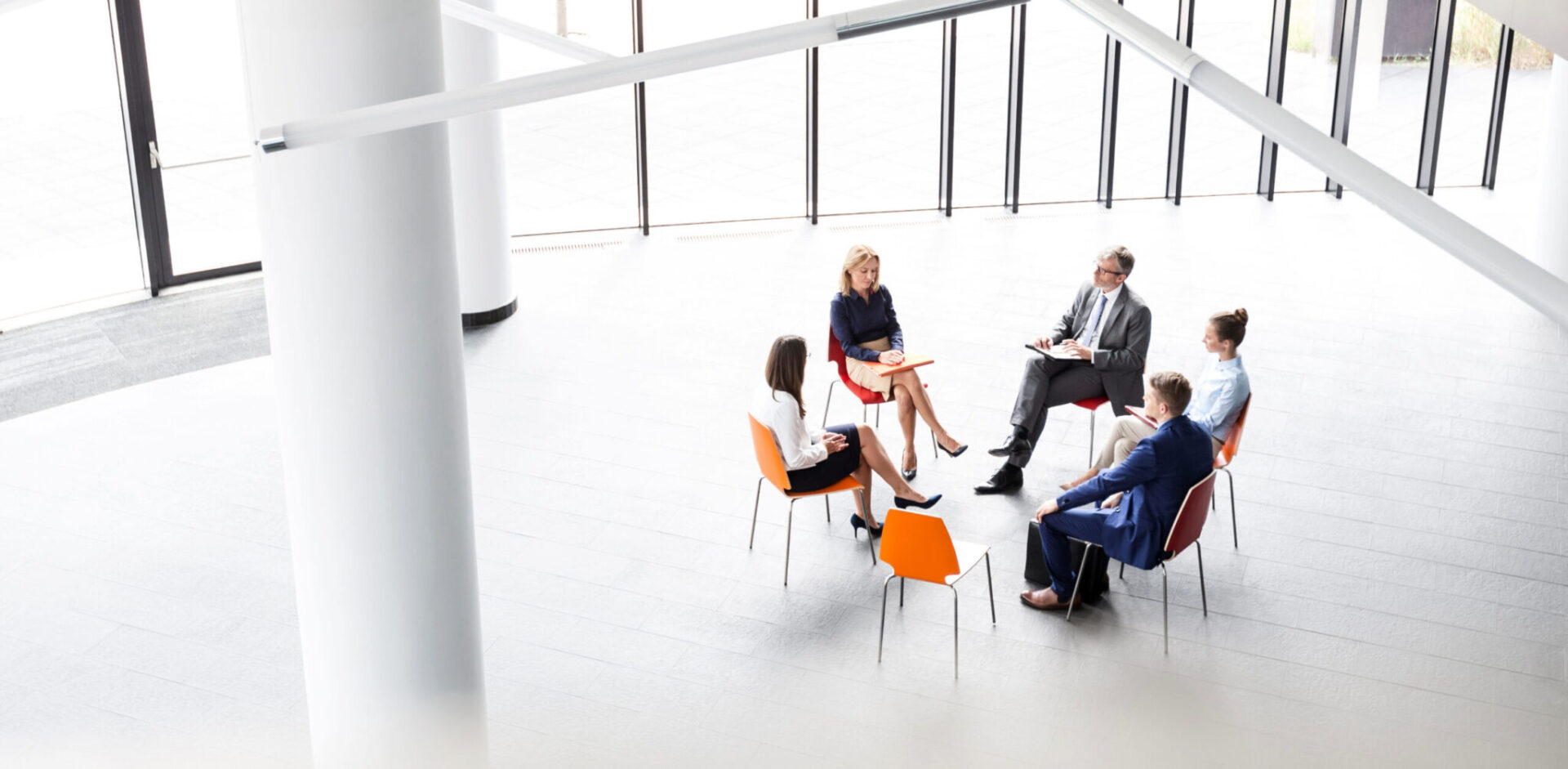 investment-bankers-sitting-on-chairs-and-discussing