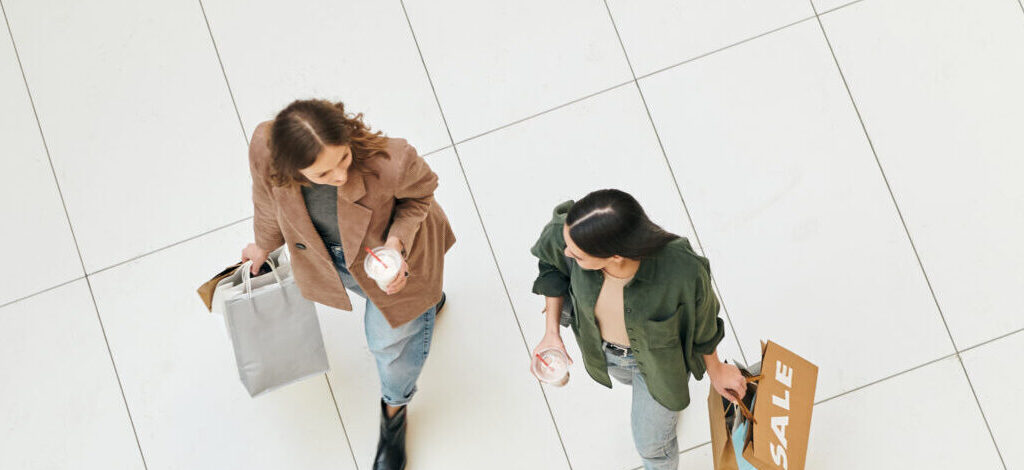 young-female-consumers-walking-in-retail-mall